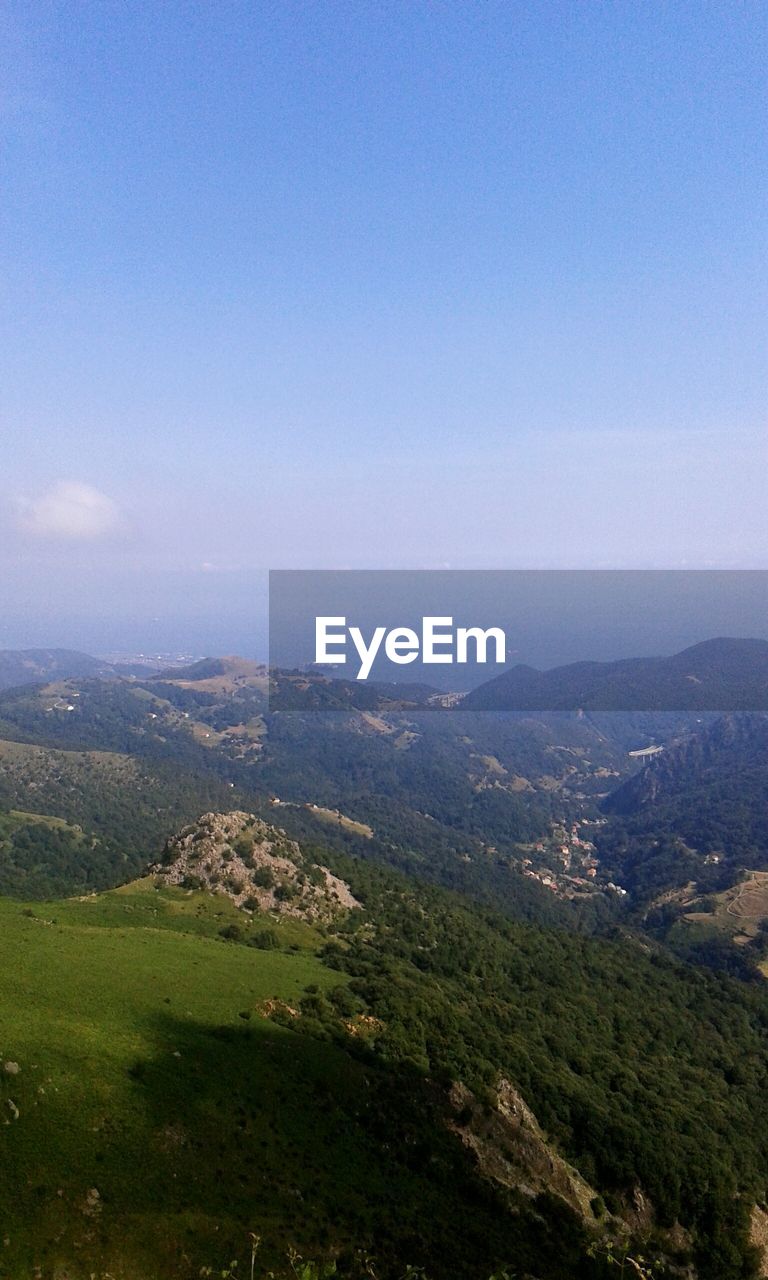 SCENIC VIEW OF LANDSCAPE AND MOUNTAINS AGAINST SKY