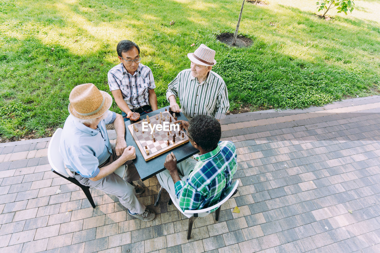 High angle view of people sitting in park