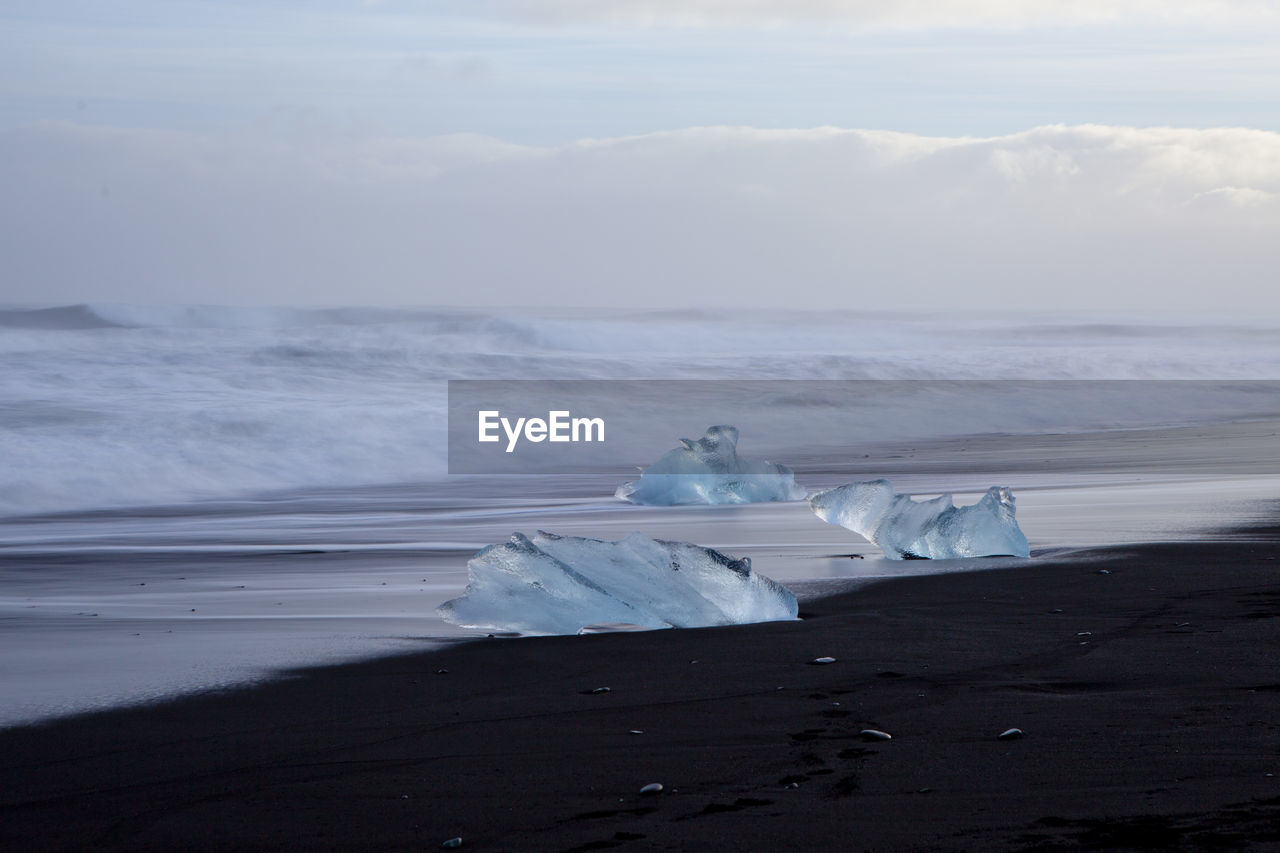 Scenic view of beach against sky