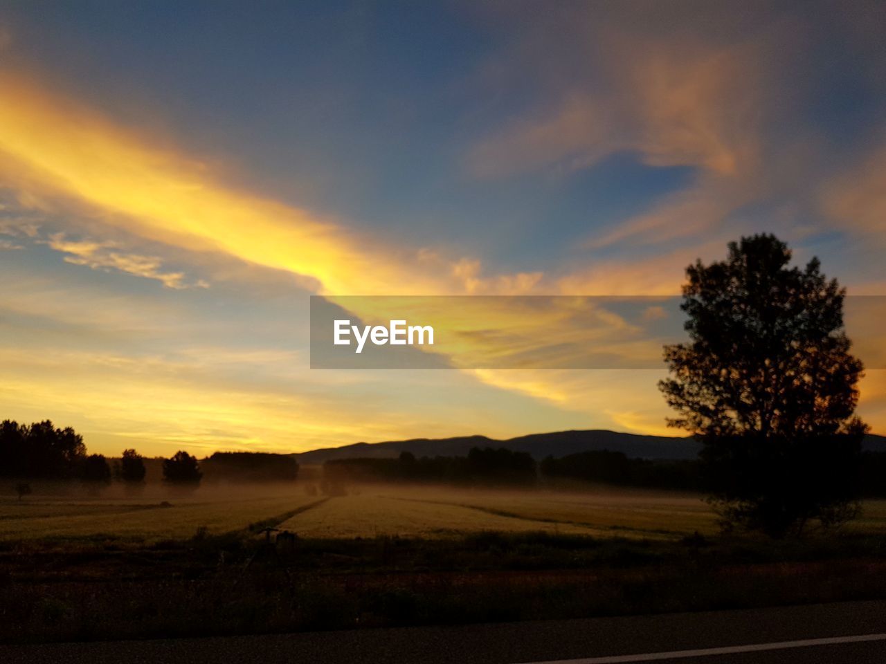 SILHOUETTE LANDSCAPE AGAINST SKY DURING SUNSET