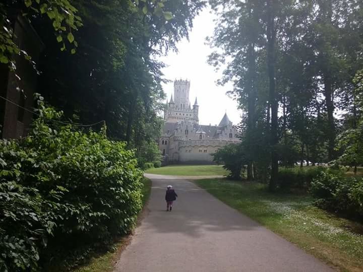 WOMAN WALKING ON FOOTPATH