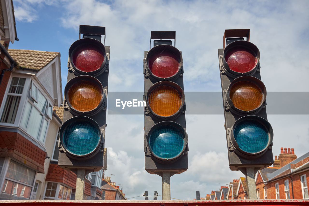A set of three traffic lights. low angle view.