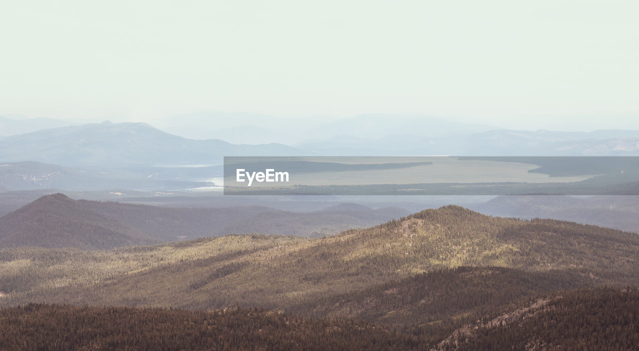 Scenic view of landscape and mountains against sky