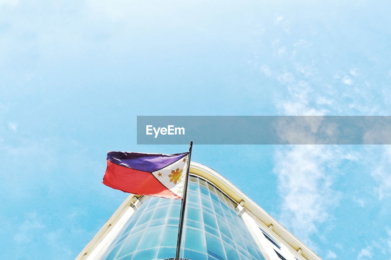 LOW ANGLE VIEW OF FLAGS FLAG AGAINST SKY