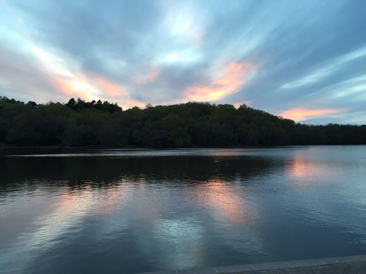 SCENIC VIEW OF LAKE AT SUNSET