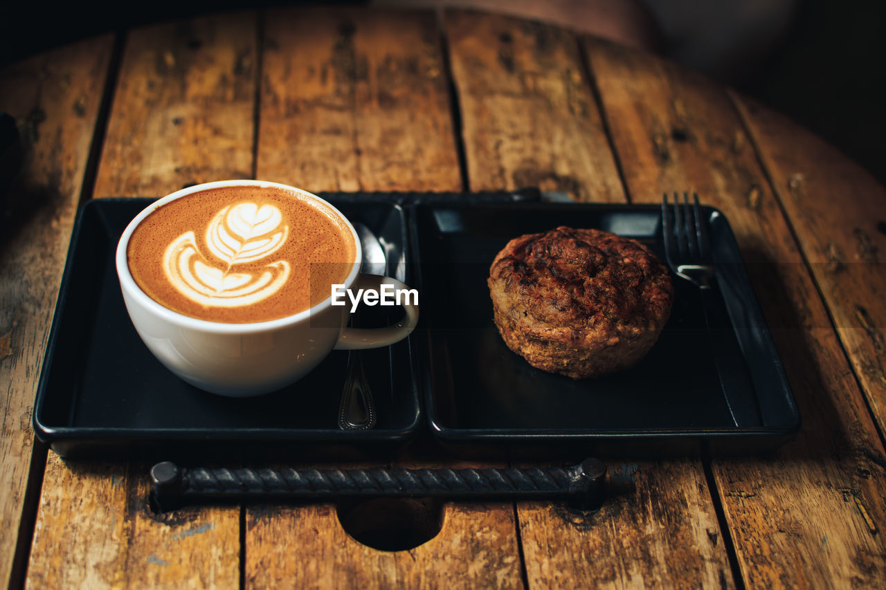 HIGH ANGLE VIEW OF COFFEE SERVED WITH CAPPUCCINO