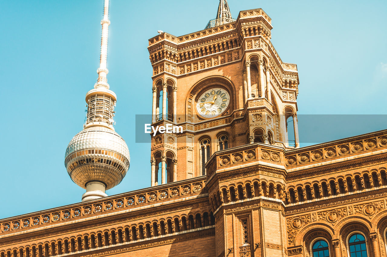 Low angle view of clock tower against sky