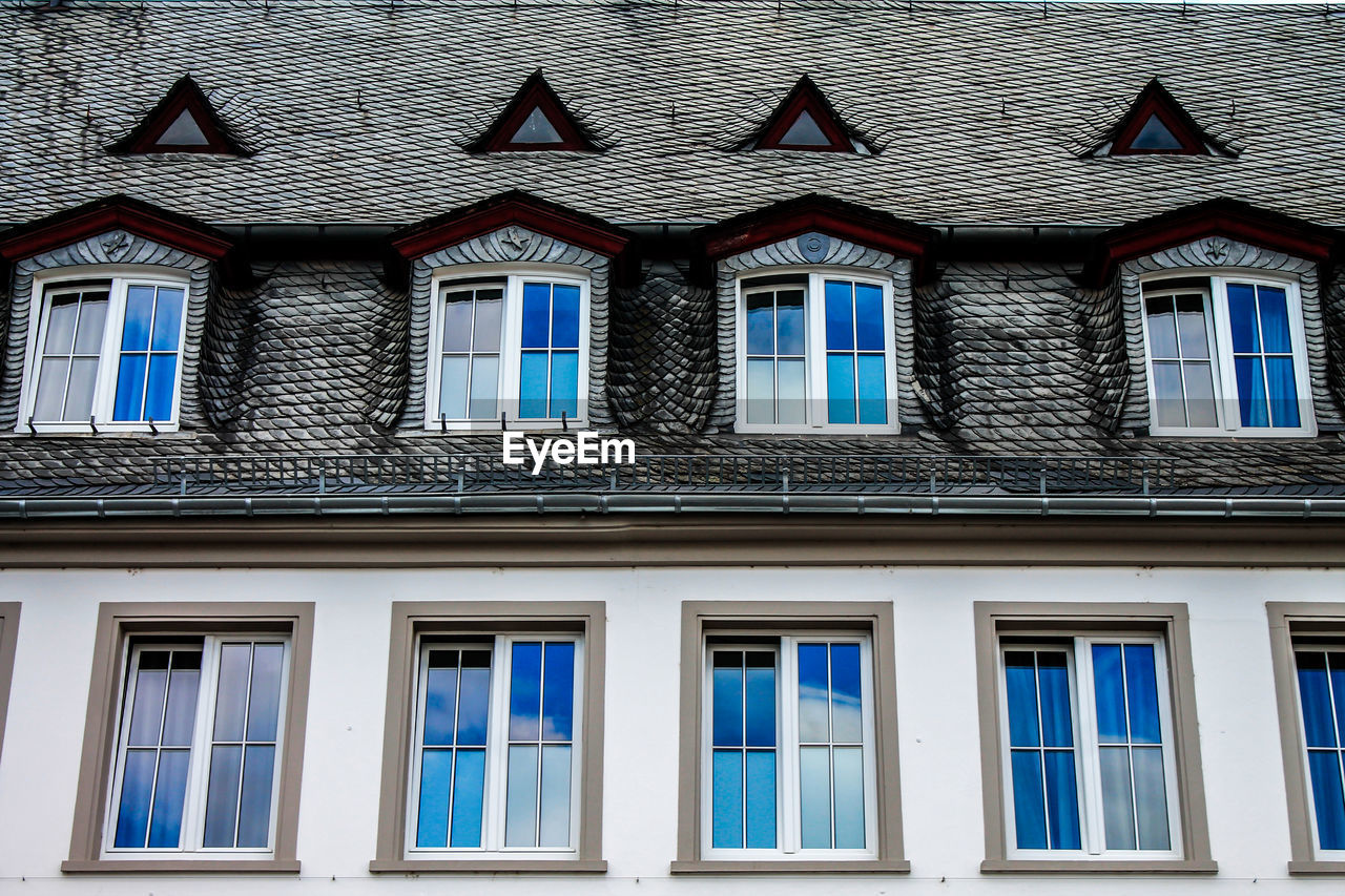 HOUSES AGAINST SKY