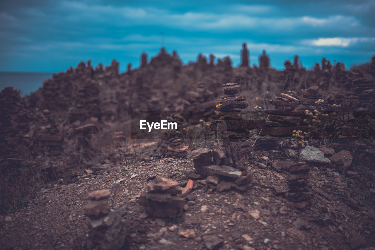 Stacks of rocks against sky