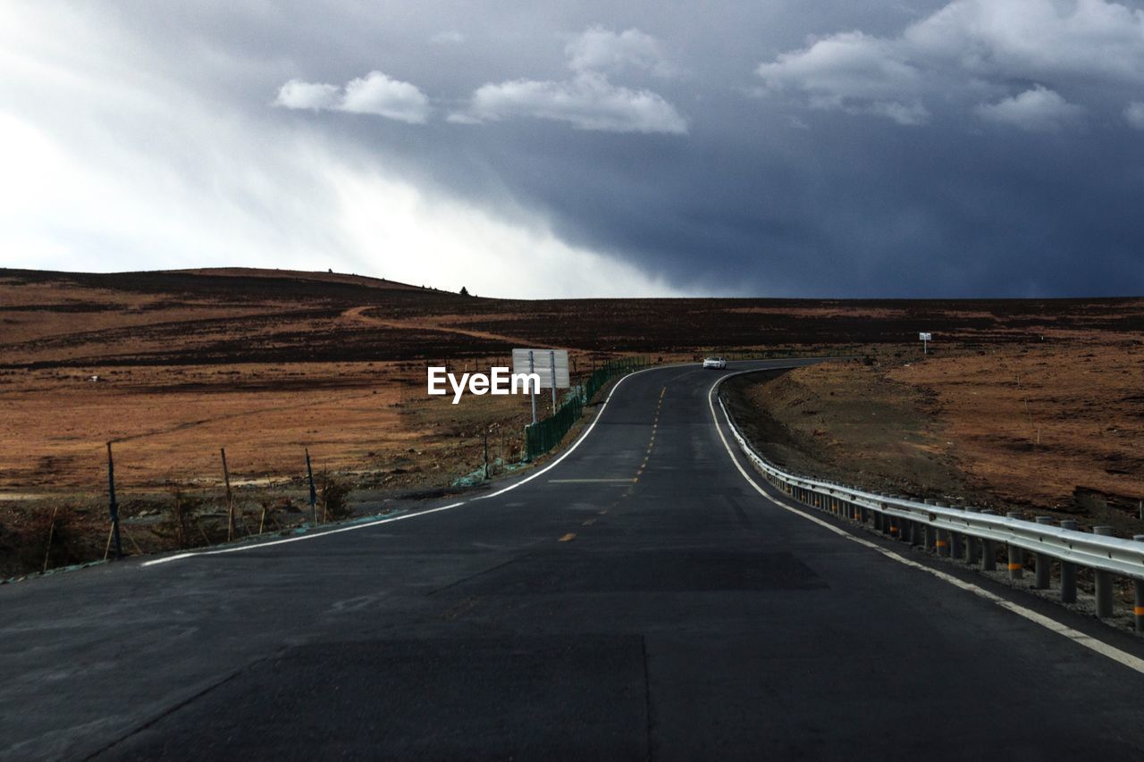 Empty road along landscape