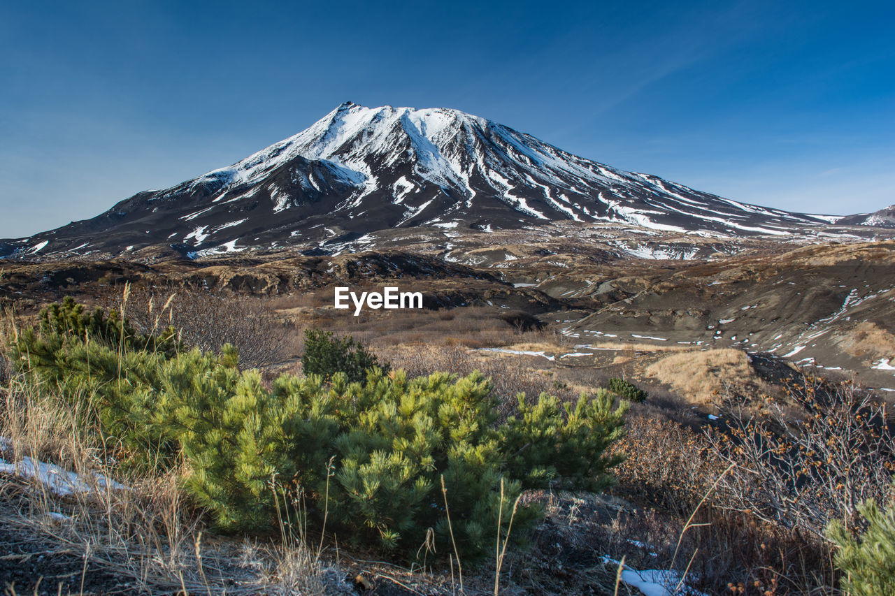 Scenic view of snowcapped mountains against sky