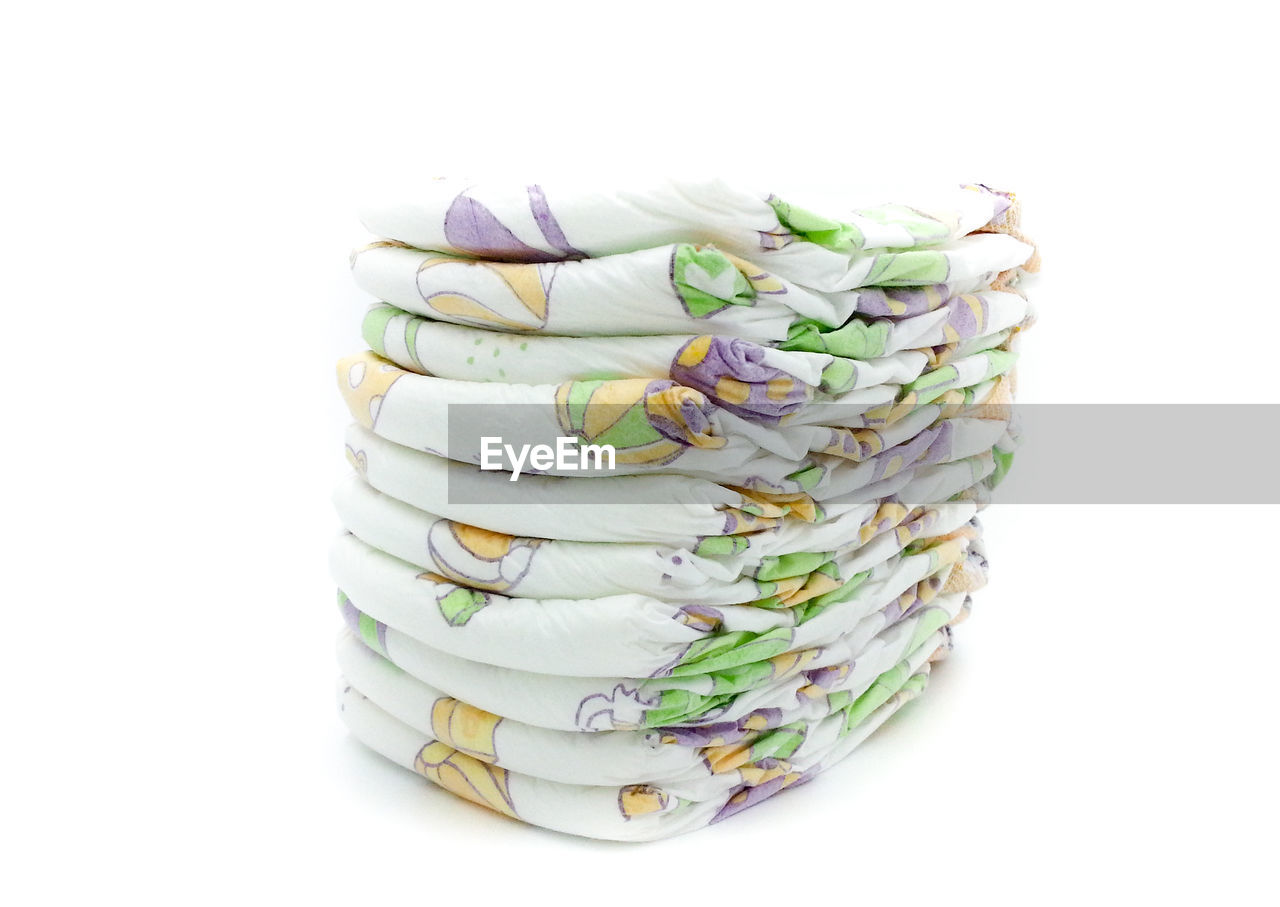 STACK OF MULTI COLORED WHITE BACKGROUND