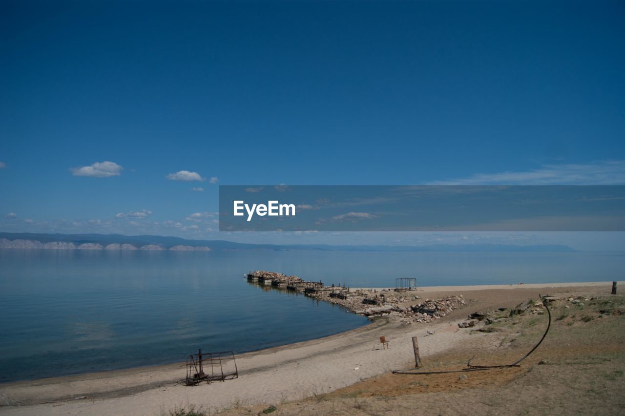 Scenic view of sea against blue sky