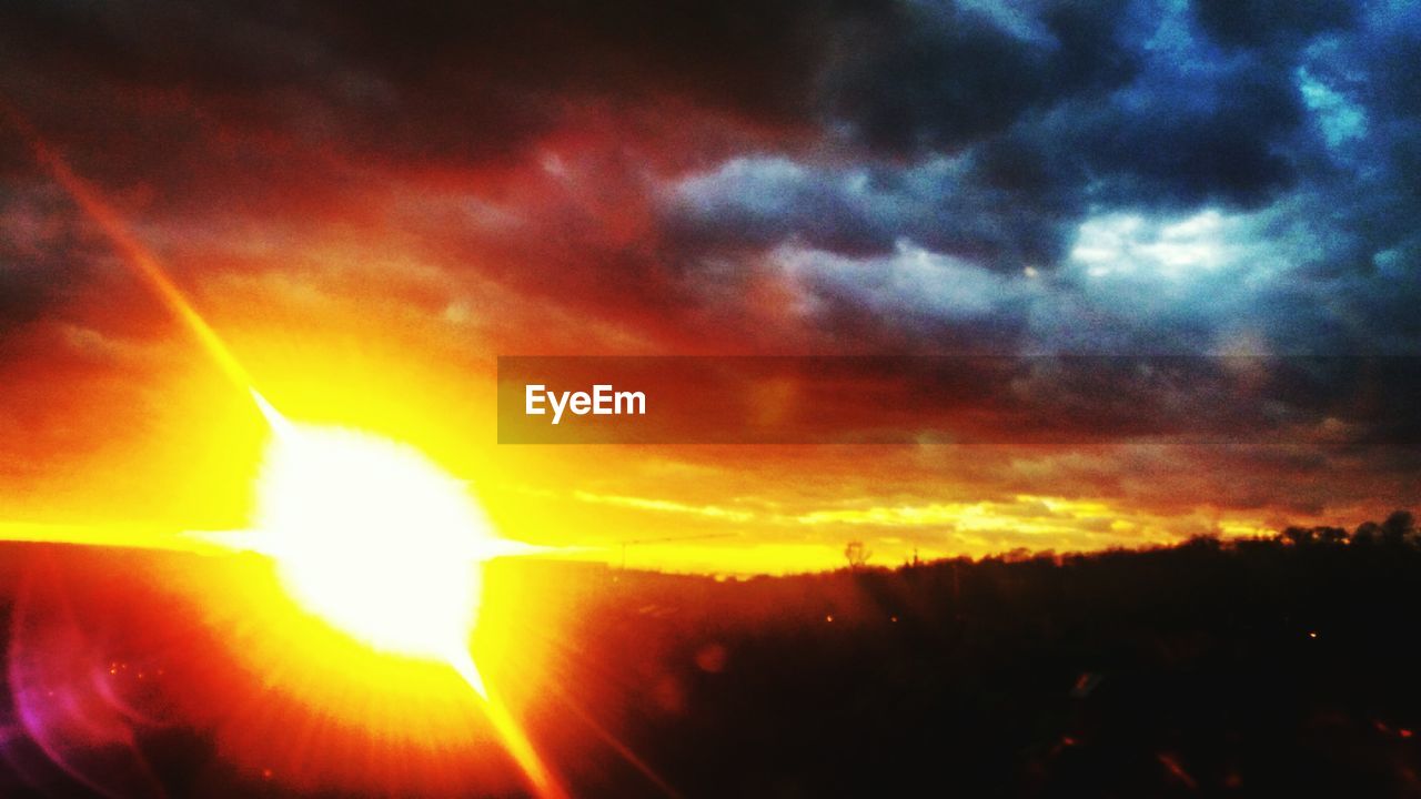 SCENIC VIEW OF SILHOUETTE ILLUMINATED AGAINST SKY AT NIGHT