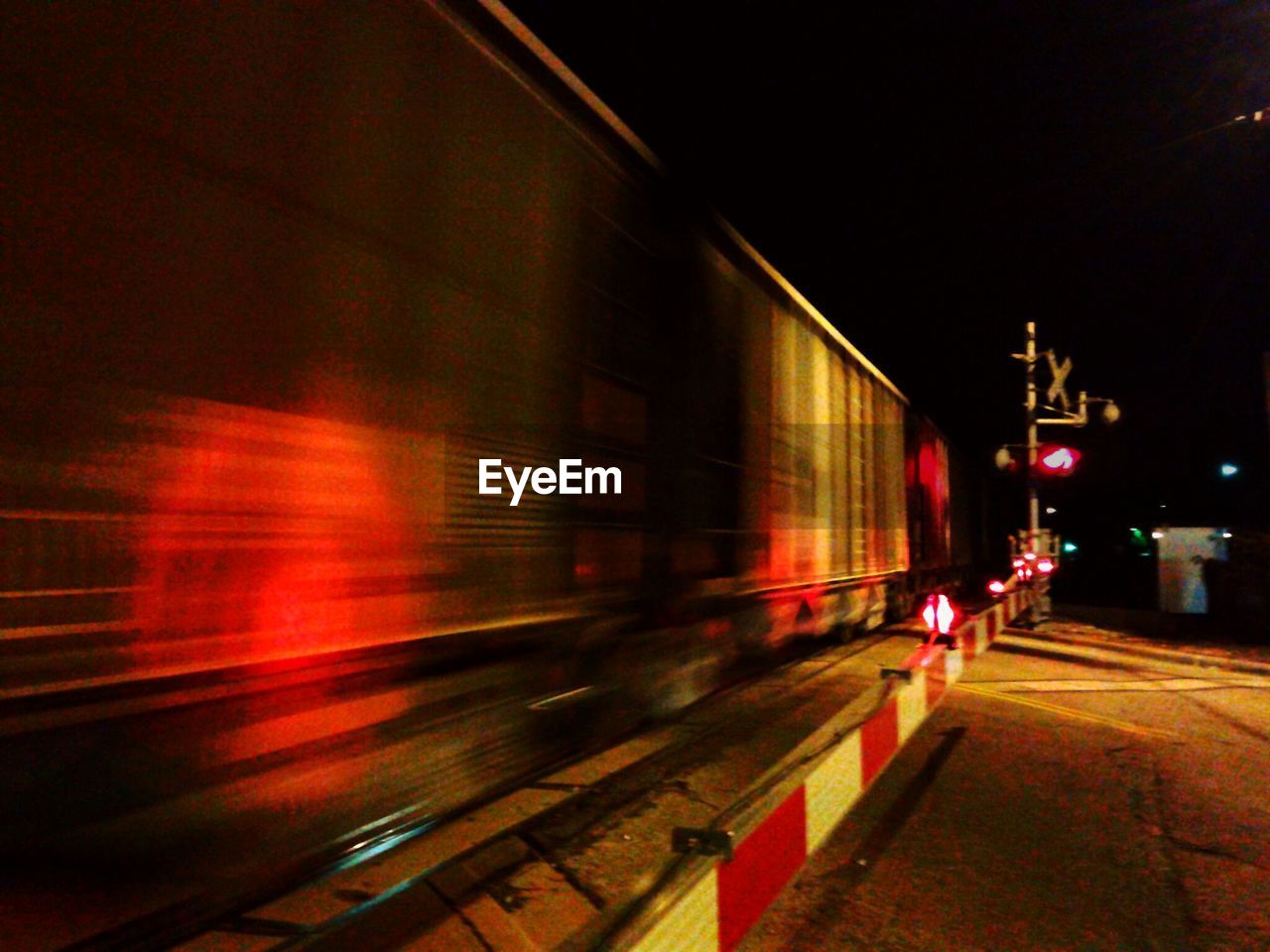 LIGHT TRAILS ON ROAD AT NIGHT