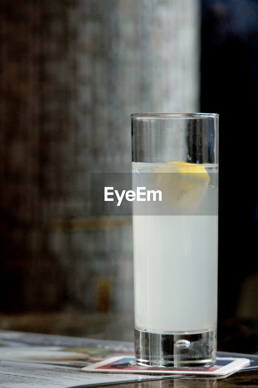 Close-up of lemonade in glass on table