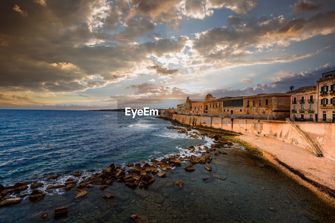 Spectacular sunset over the sea with maniace castle