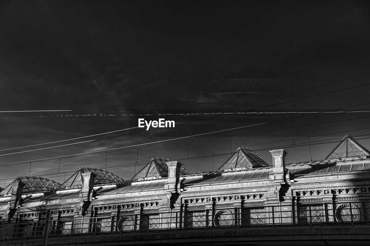 Buildings against sky at night