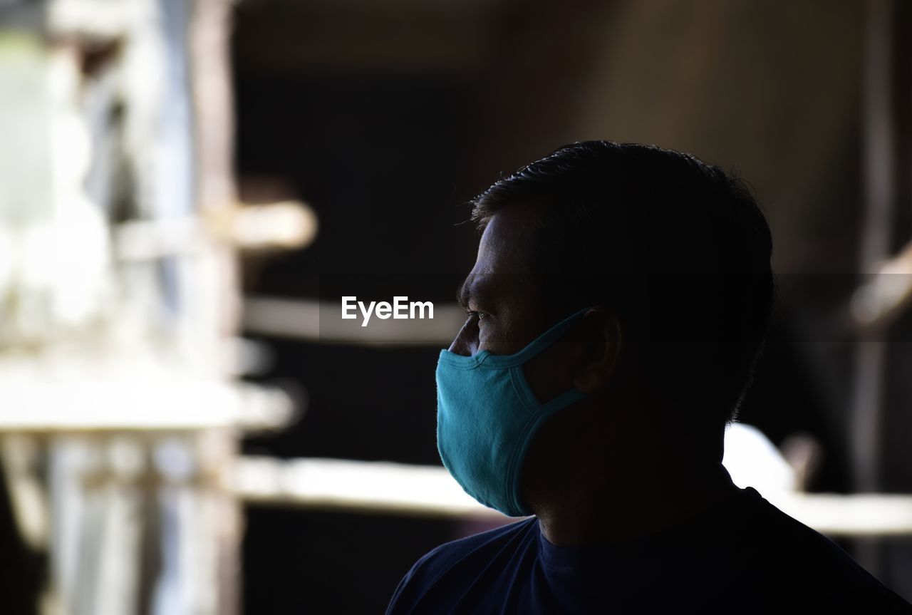 Close-up portrait of man with face mask