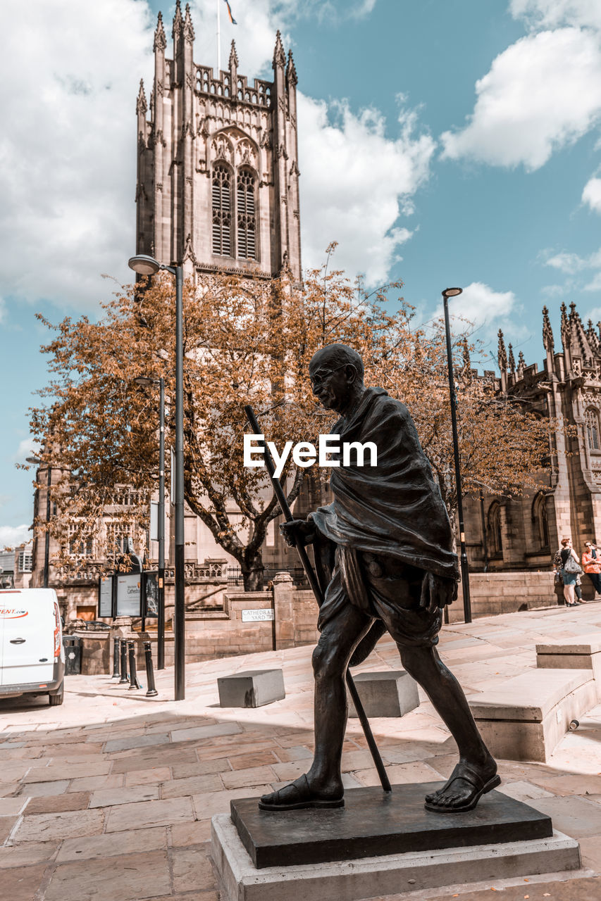 Ghandi statue in front of manchester cathedral