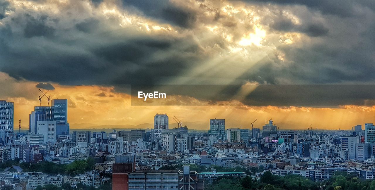 Panoramic view of city against sky during sunset