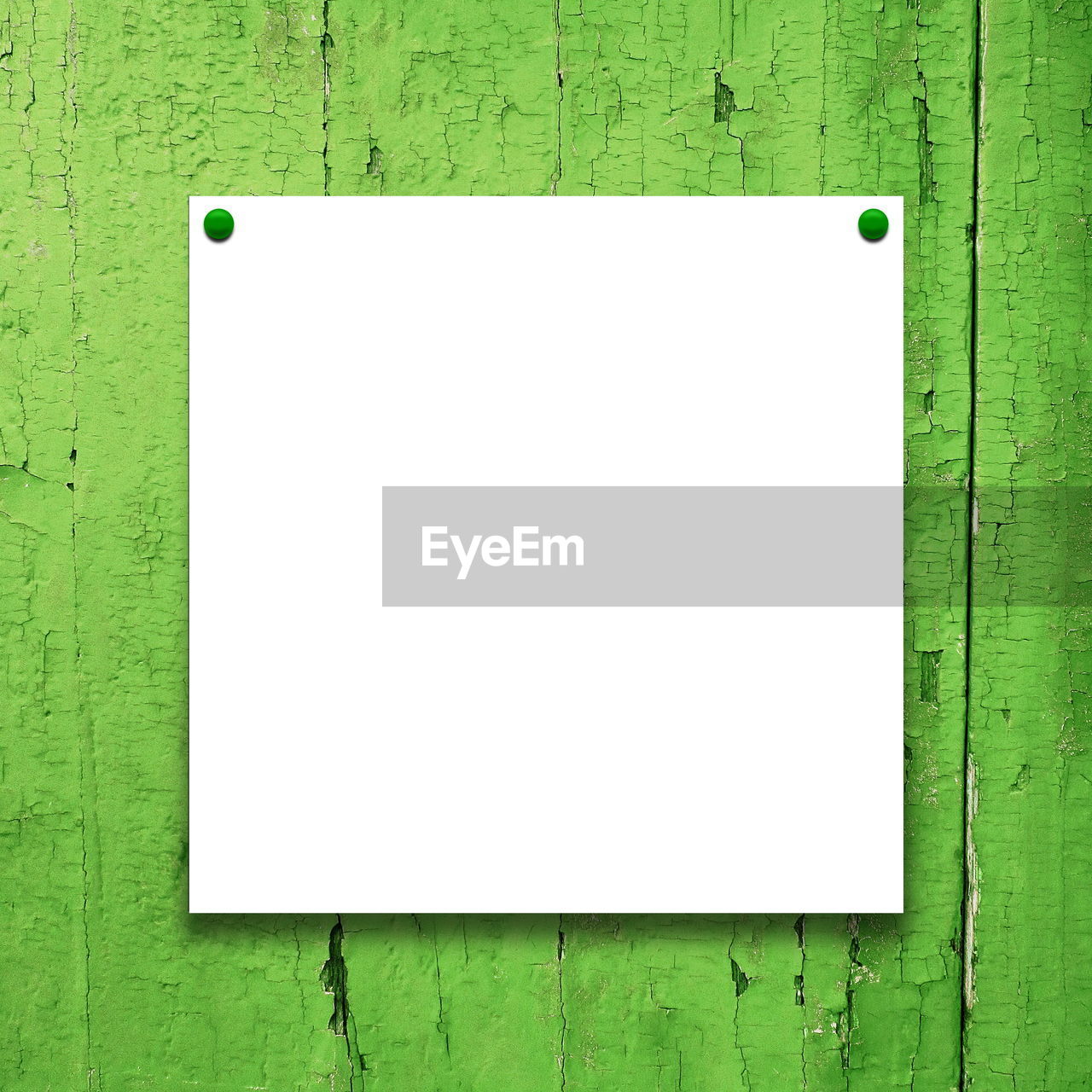 Close-up of paper hanging against wooden wall