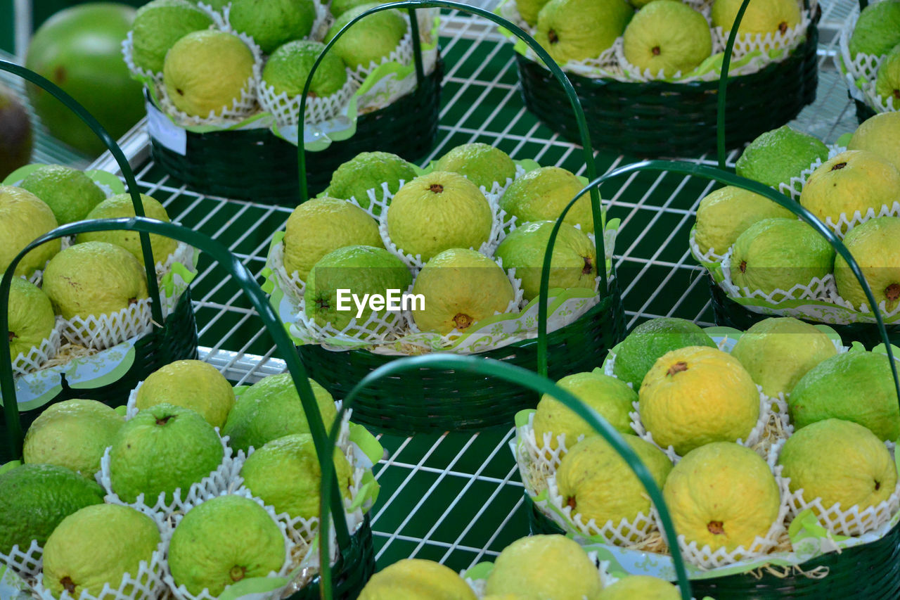 High angle view of guavas fruits in basket