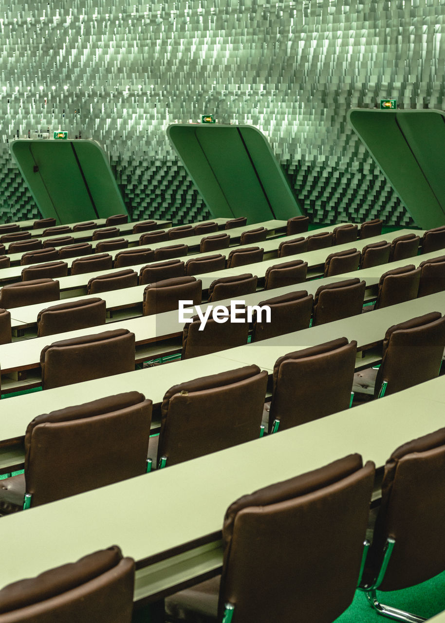 HIGH ANGLE VIEW OF EMPTY CHAIRS IN OFFICE