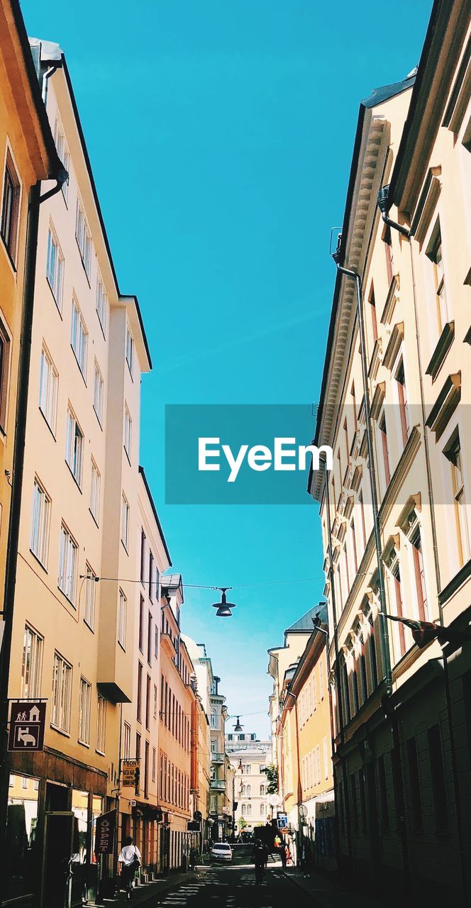 Low angle view of buildings against blue sky