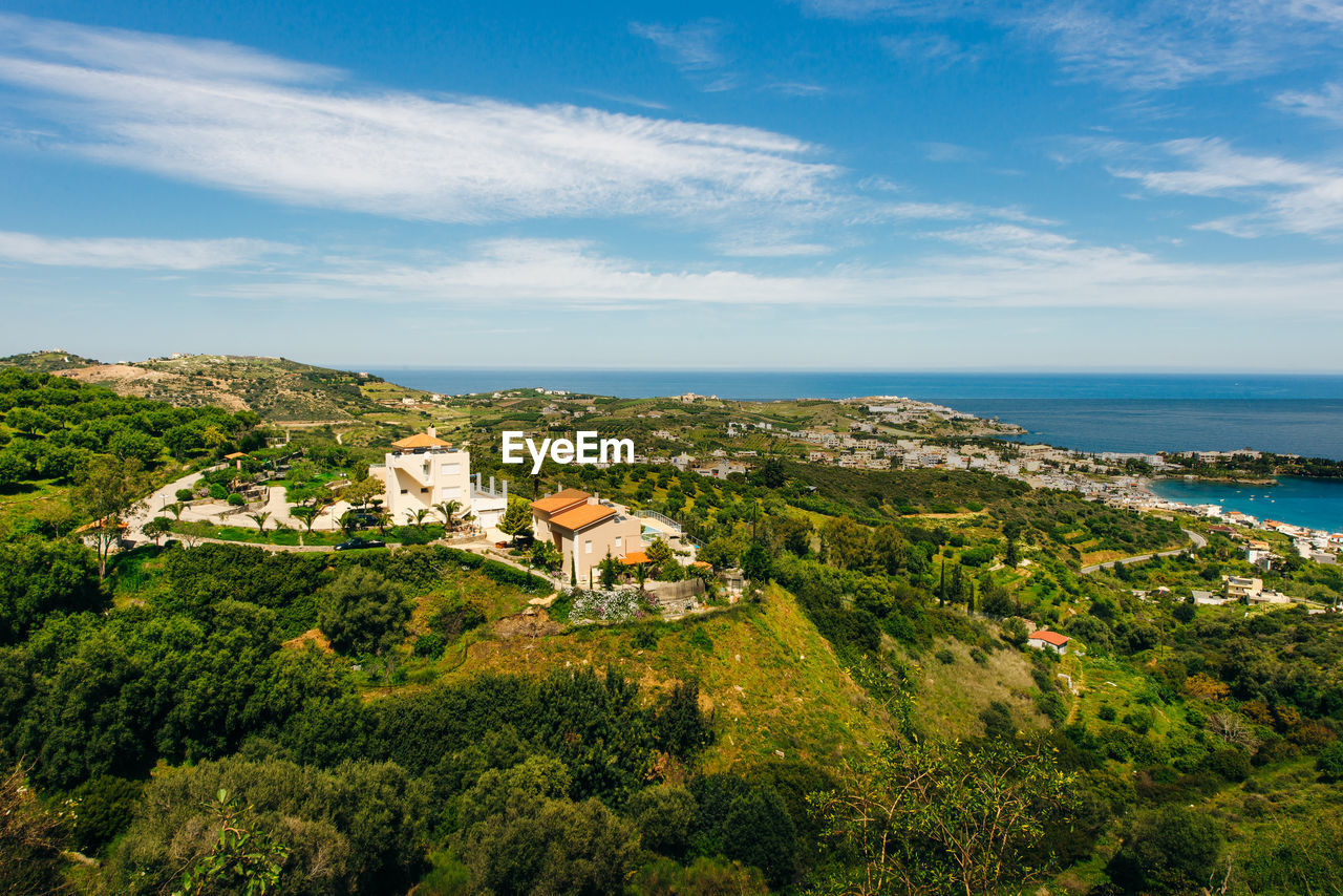 SCENIC VIEW OF SEA AGAINST BUILDINGS