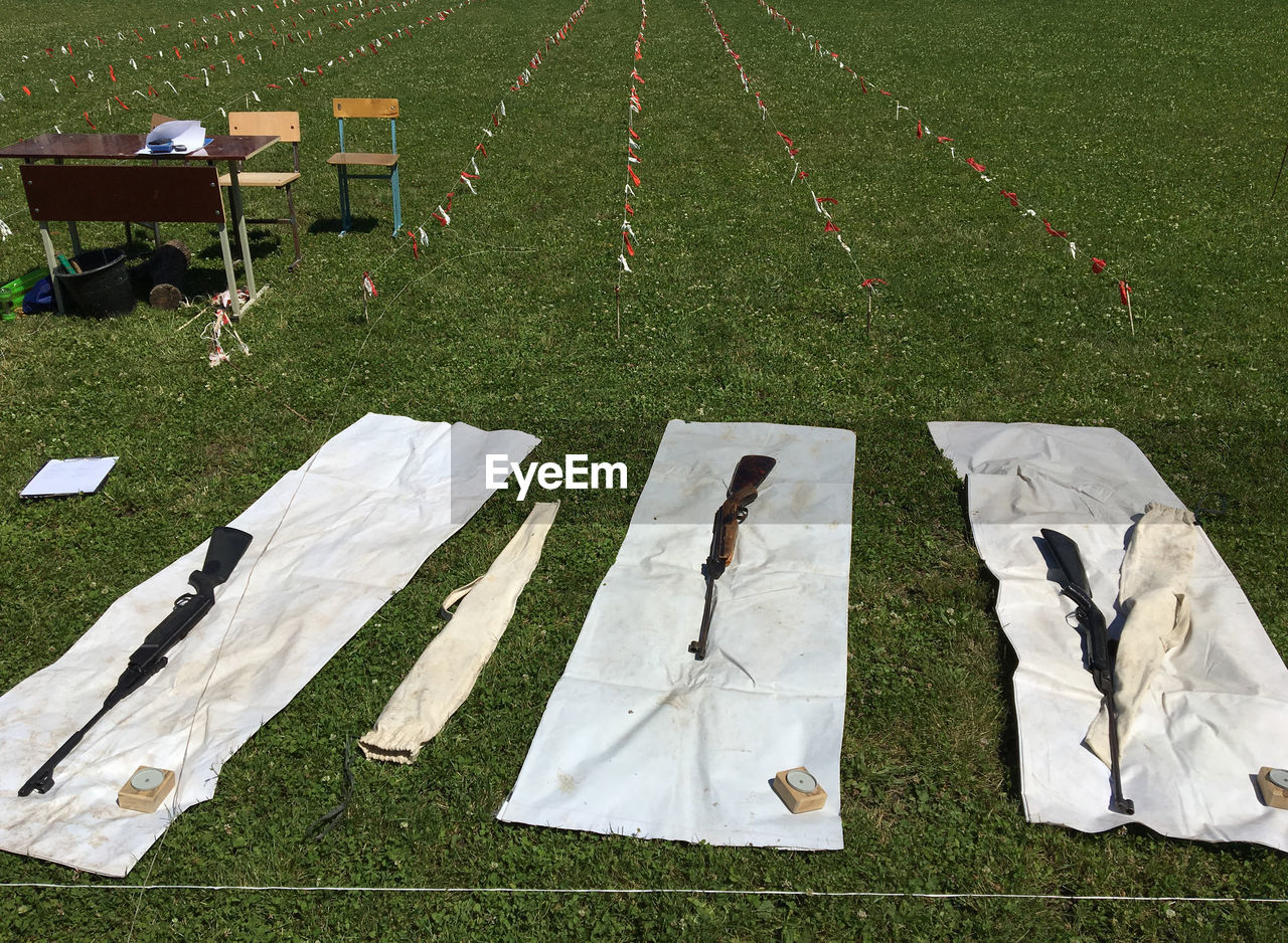 HIGH ANGLE VIEW OF DRYING ON FIELD