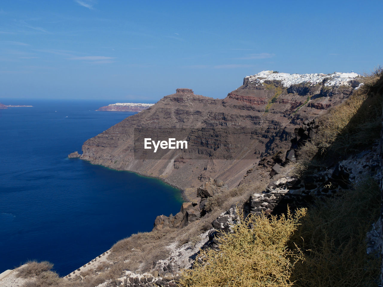 Scenic view of sea against blue sky