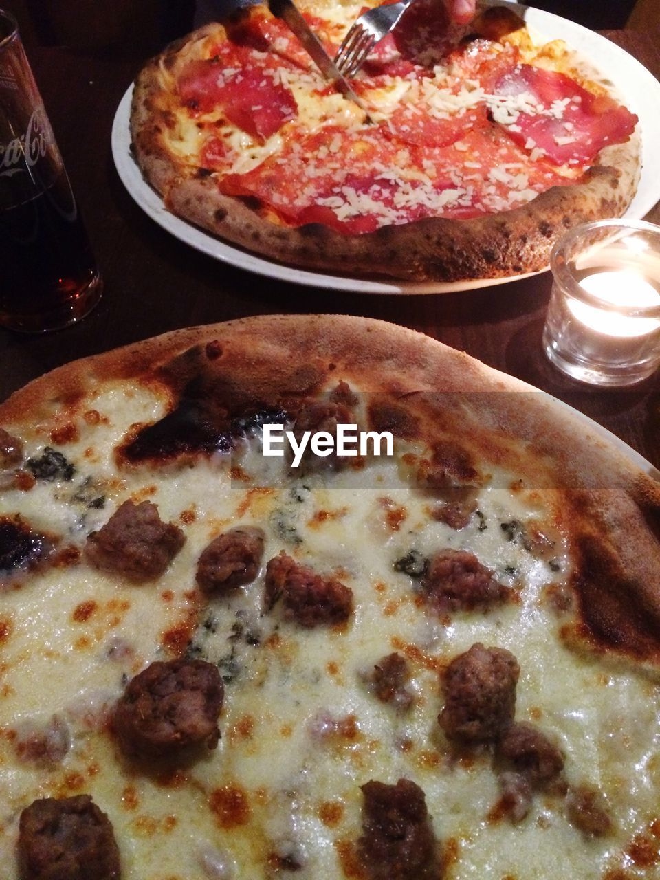 Close-up of pizza served on table in restaurant