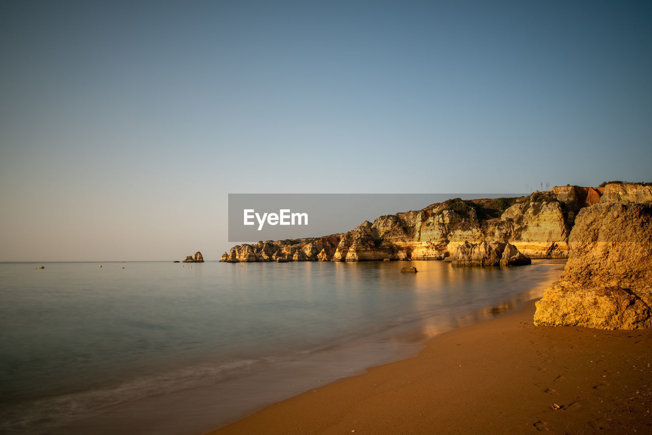 Scenic view of sea against clear sky