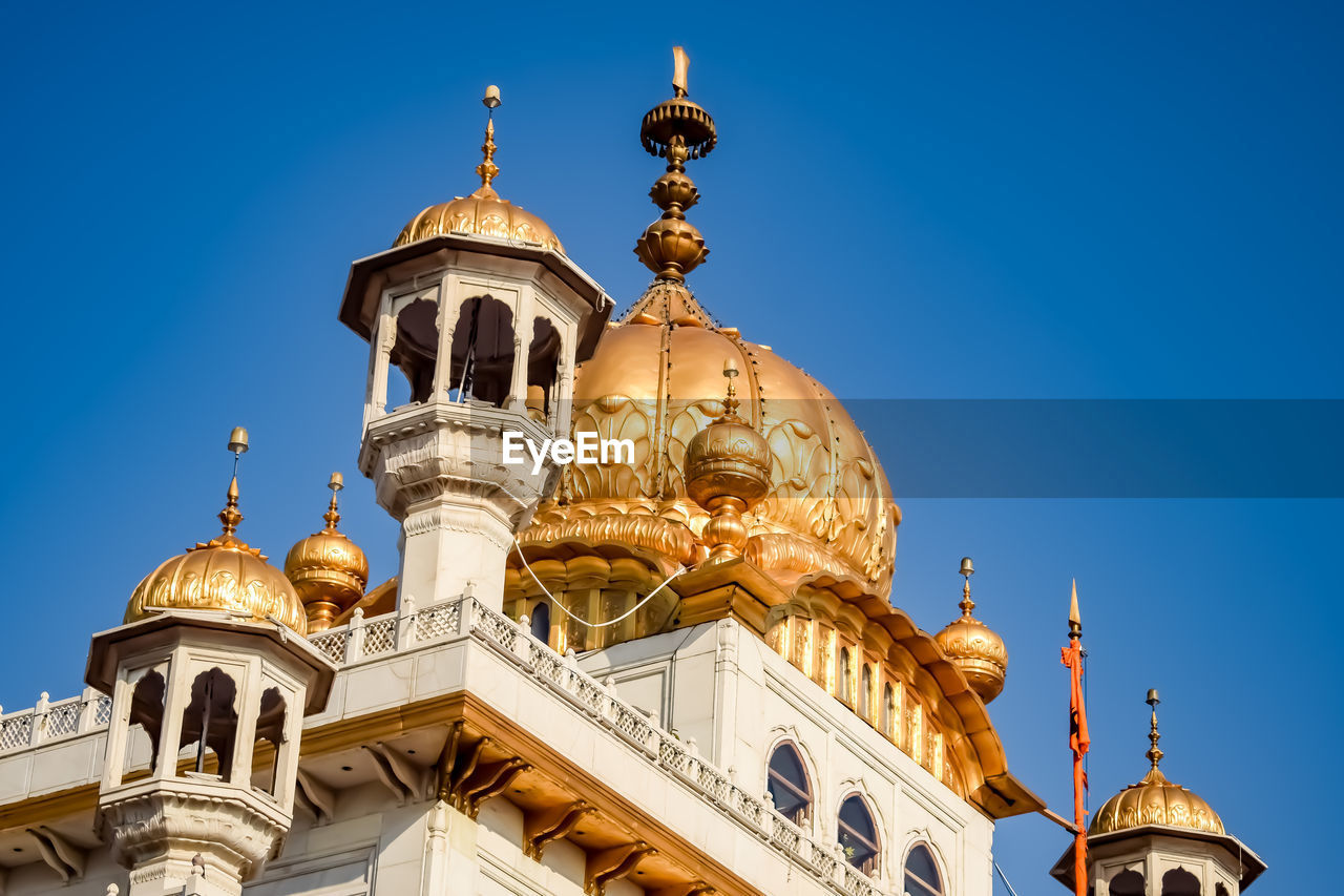 low angle view of mosque against clear blue sky