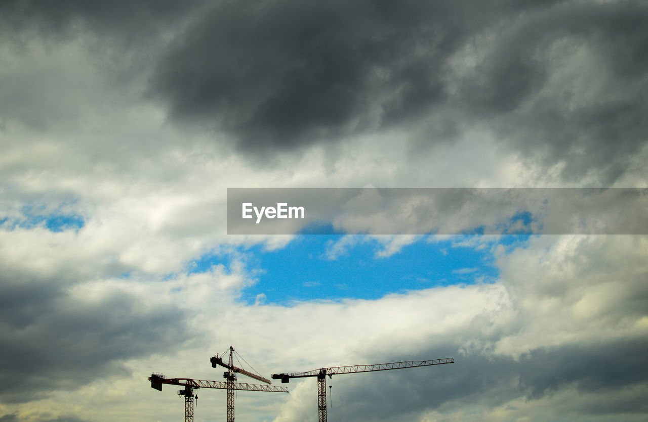 LOW ANGLE VIEW OF SKY AND CLOUDS IN THE BACKGROUND