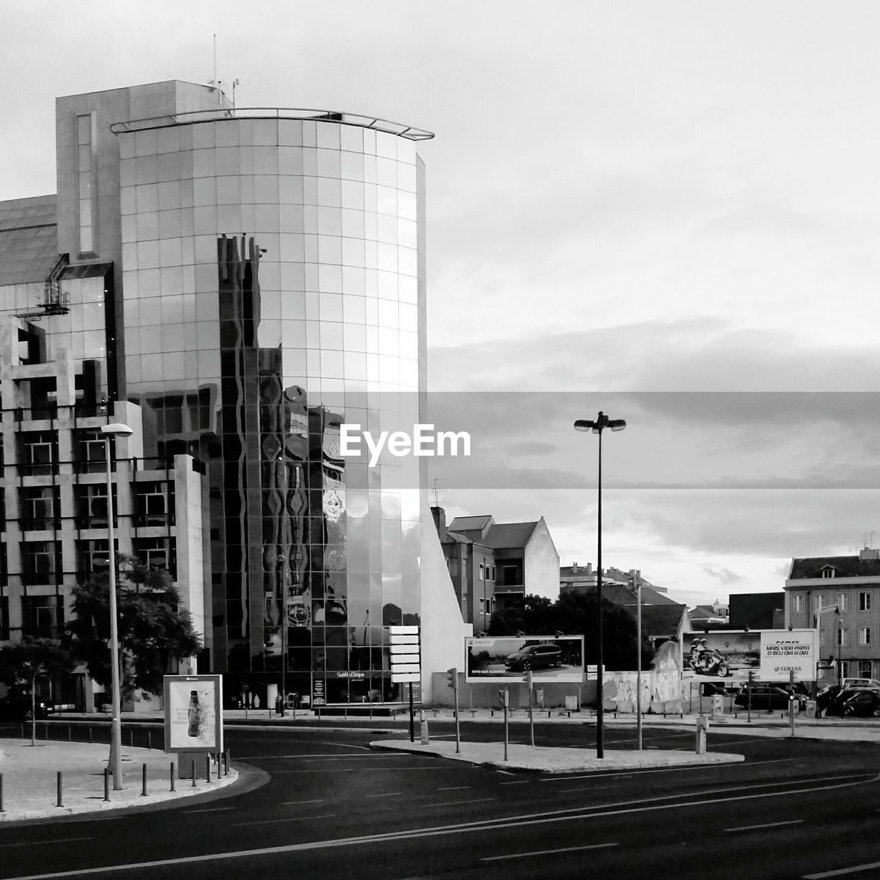 ROAD BY BUILDINGS AGAINST SKY