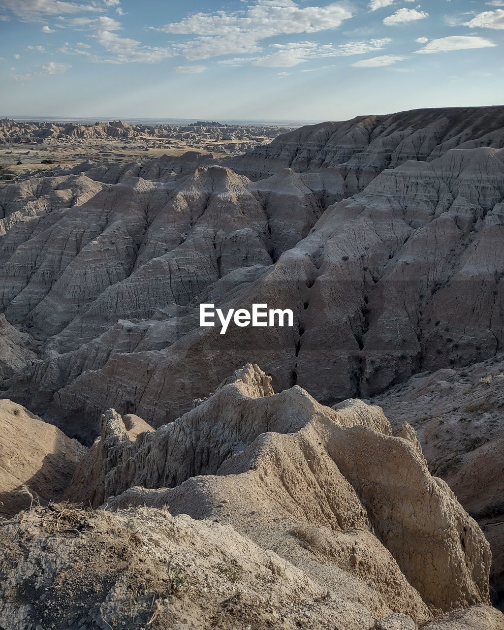 landscape, environment, rock, scenics - nature, land, nature, beauty in nature, sky, mountain, wilderness, geology, non-urban scene, cloud, no people, rock formation, volcano, natural environment, desert, physical geography, tranquility, day, travel destinations, plateau, outdoors, tranquil scene, valley, arid climate, wadi, climate, extreme terrain, travel, remote, volcanic landscape, ridge