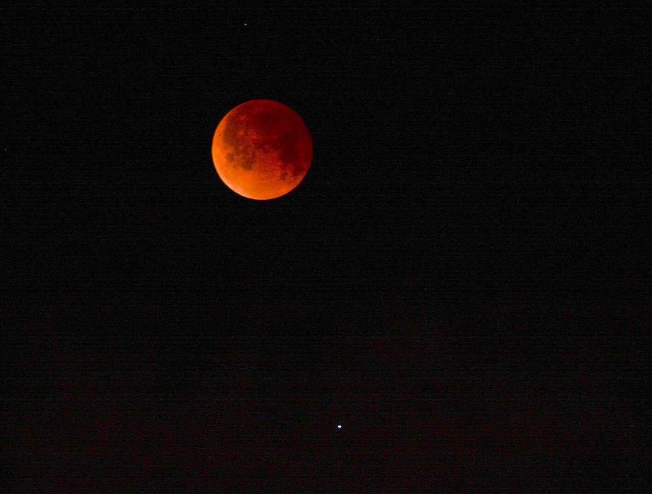 LOW ANGLE VIEW OF MOON IN SKY