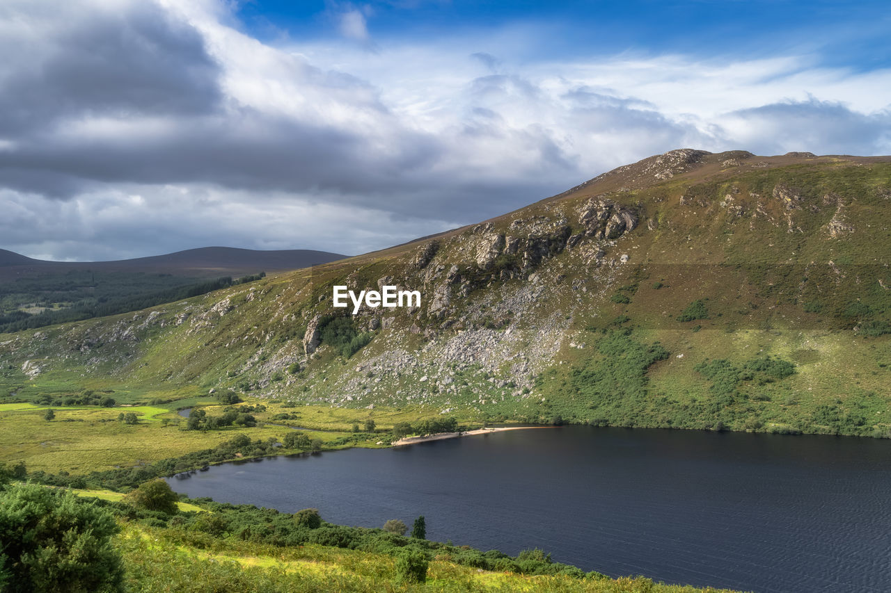 Panorama with lake, beach, forest, valley and rocky mountain. lough dan in wicklow mountains ireland