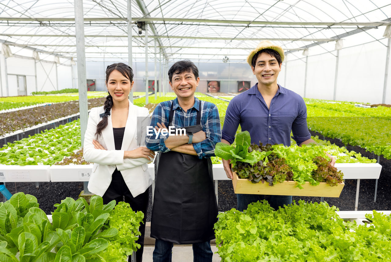 A guy and a woman farmer present on the farm with a smile and pride in their own start-up business.