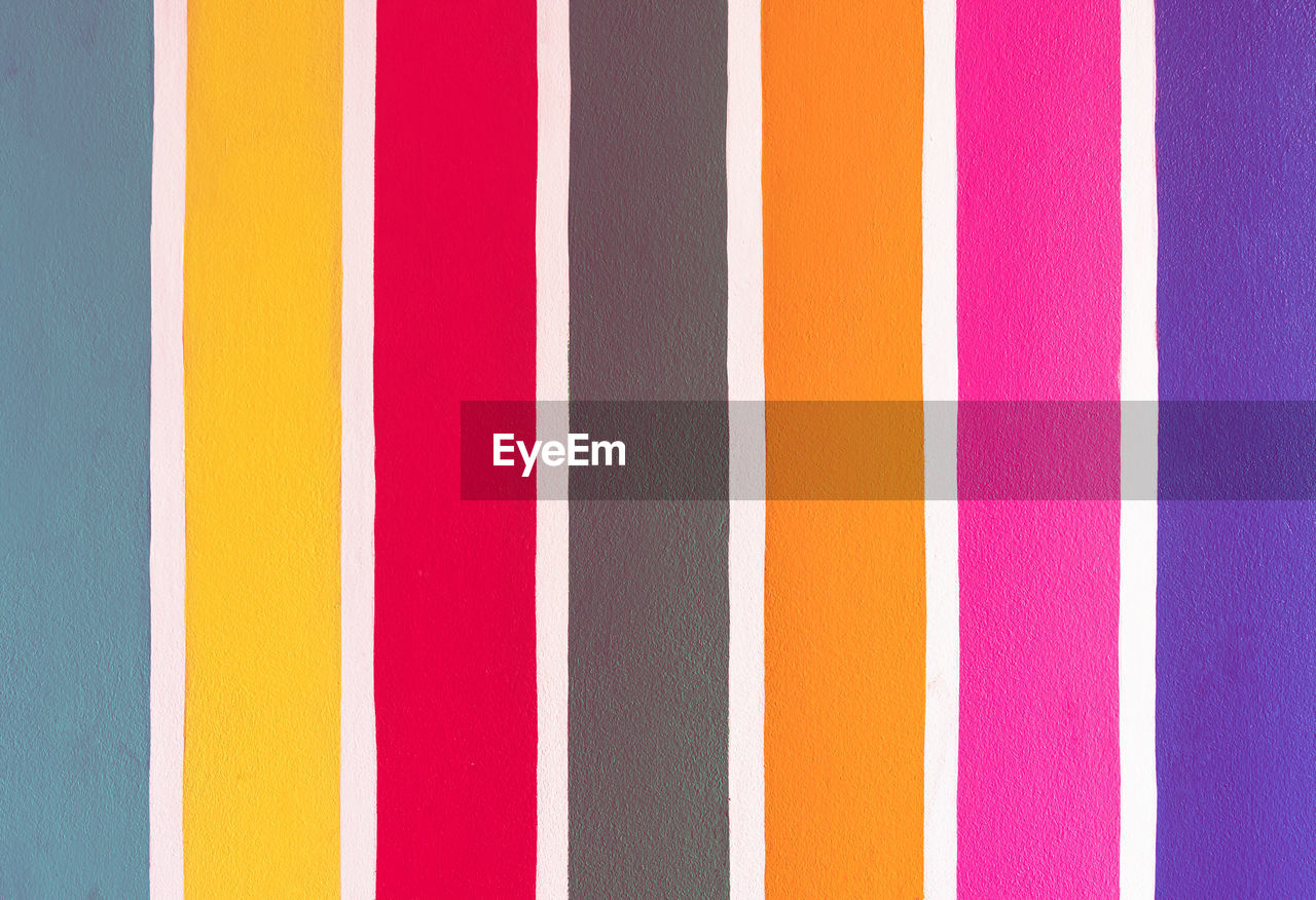 multi colored, full frame, backgrounds, no people, yellow, pink, orange, pattern, striped, line, close-up, purple, circle, variation, wall - building feature, magenta, side by side, font, in a row, architecture, indoors, day, red, vibrant color, flag
