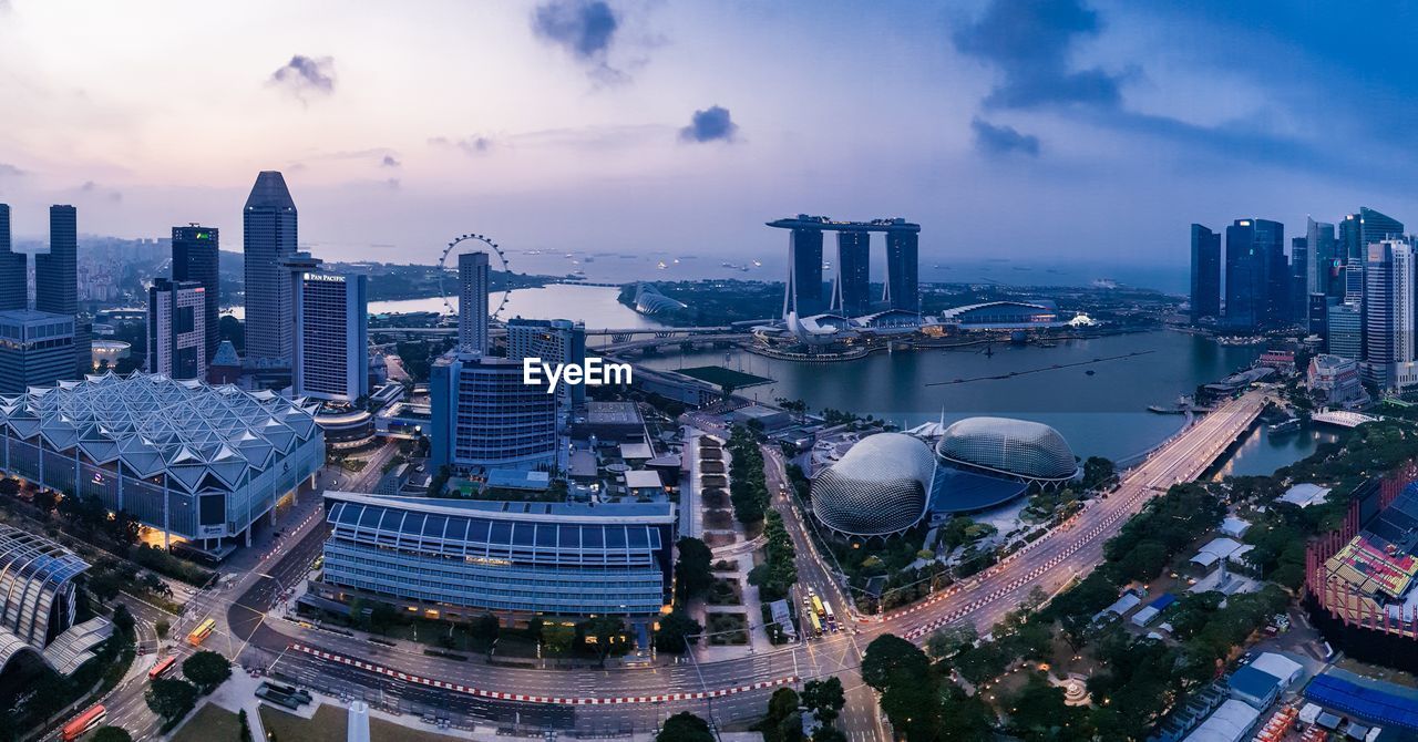 High angle view of modern buildings in city against sky