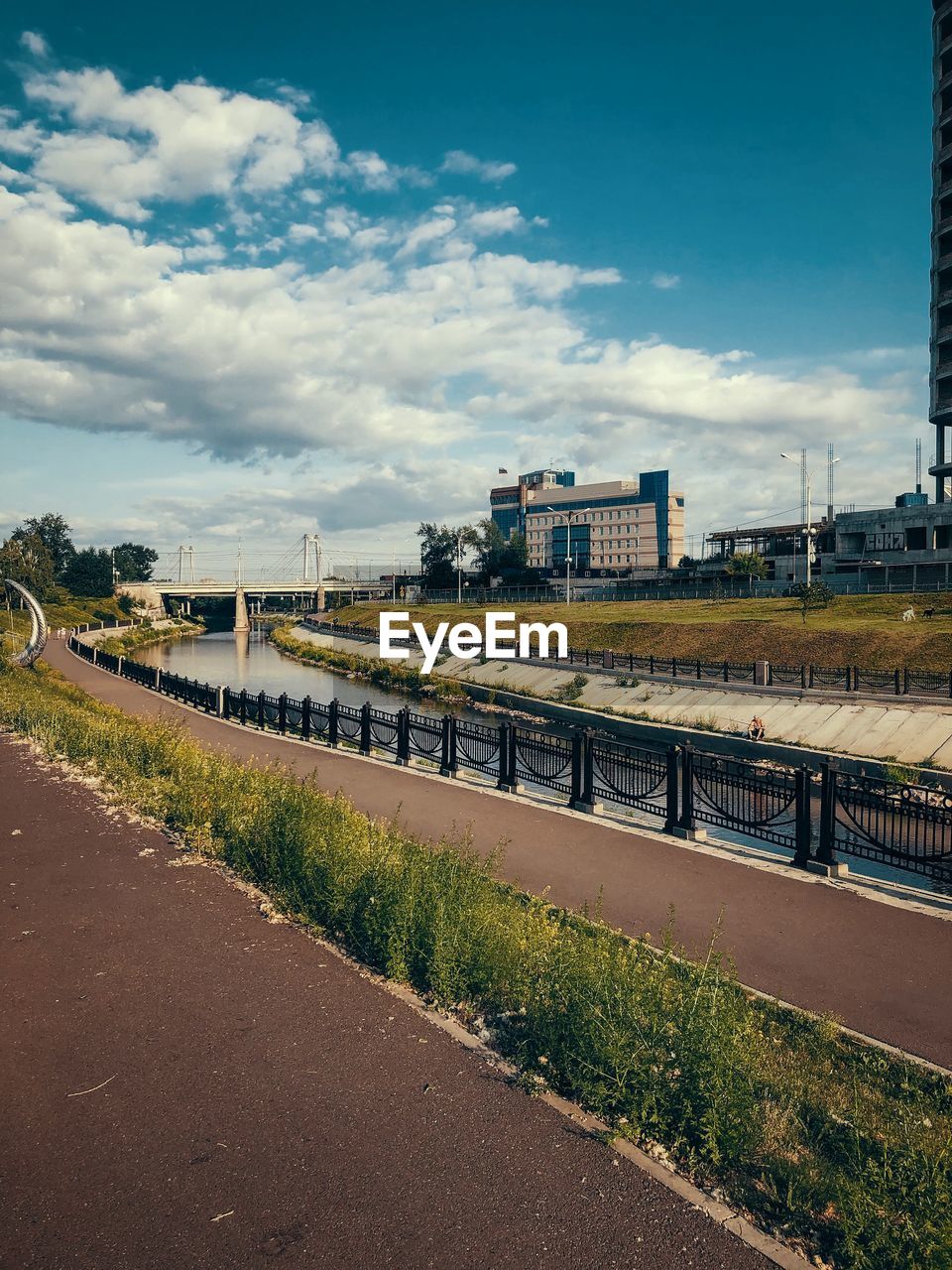 ROAD BY BRIDGE AGAINST SKY