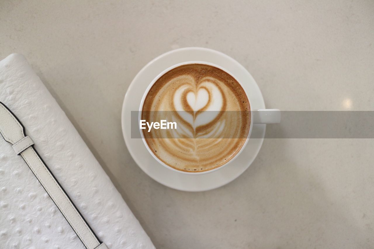 High angle view of cappuccino on table