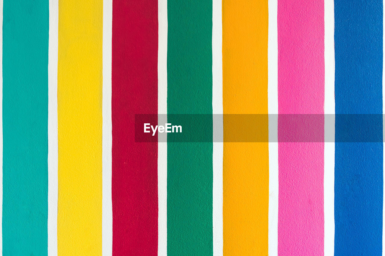 multi colored, striped, backgrounds, full frame, no people, pattern, yellow, variation, close-up, line, orange, circle, in a row, side by side, pink, font, indoors, vibrant color, flag, creativity