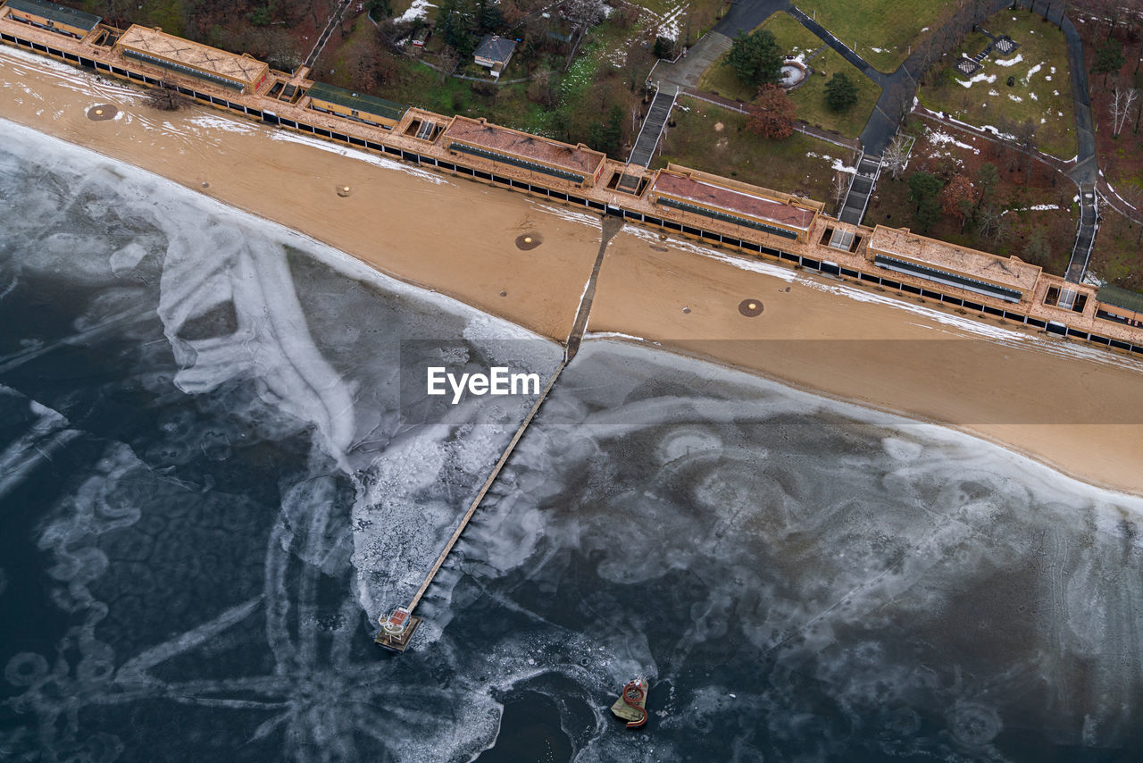 HIGH ANGLE VIEW OF BRIDGE OVER RIVER AGAINST SKY