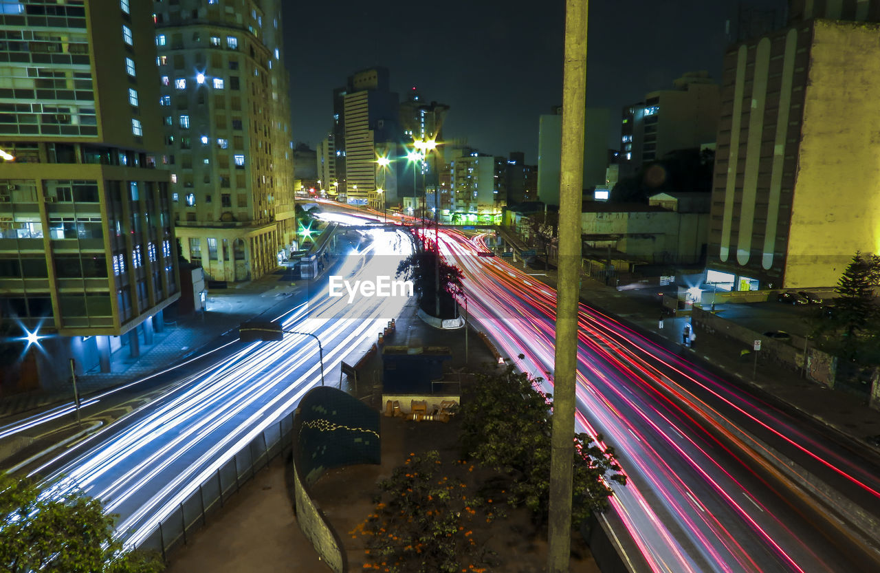 Cars moving on city street at night