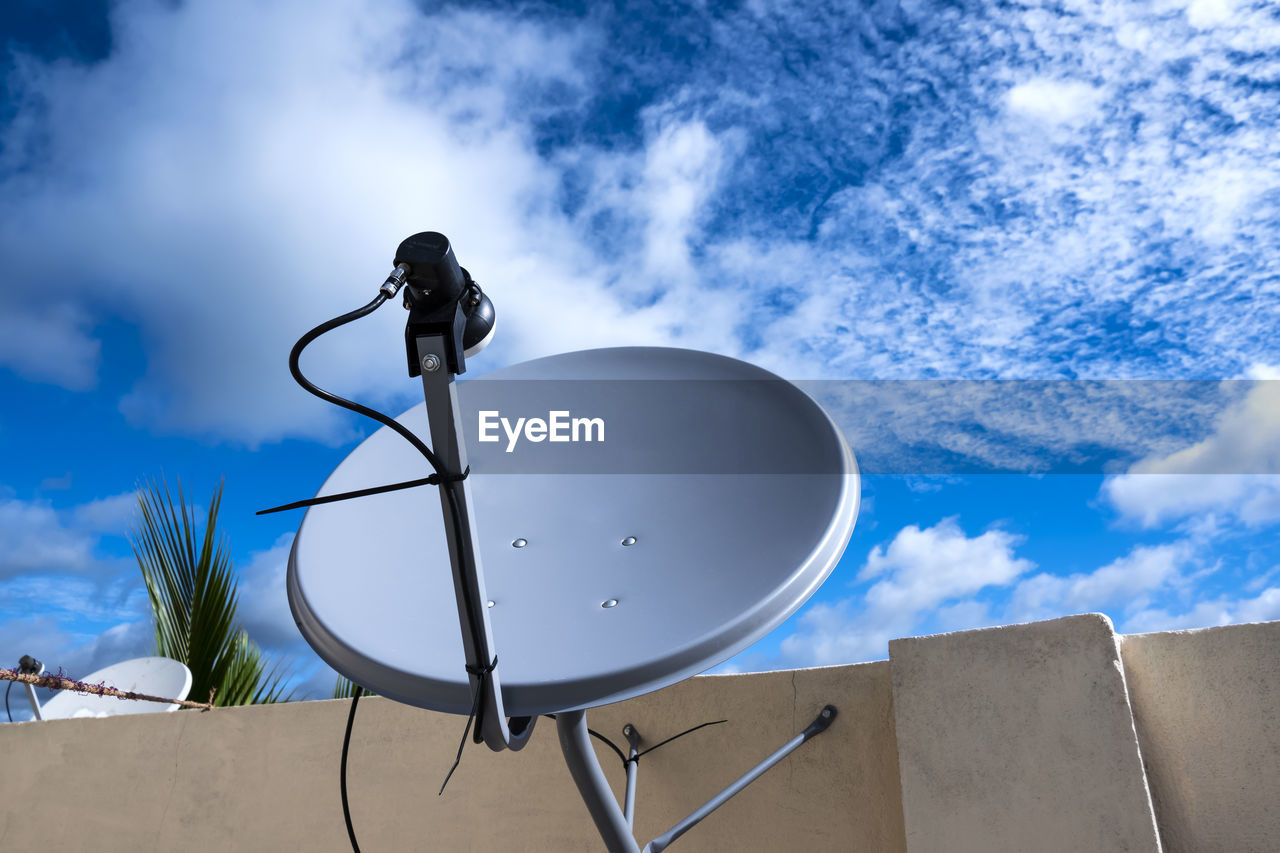 Low angle view of satellite dish against sky