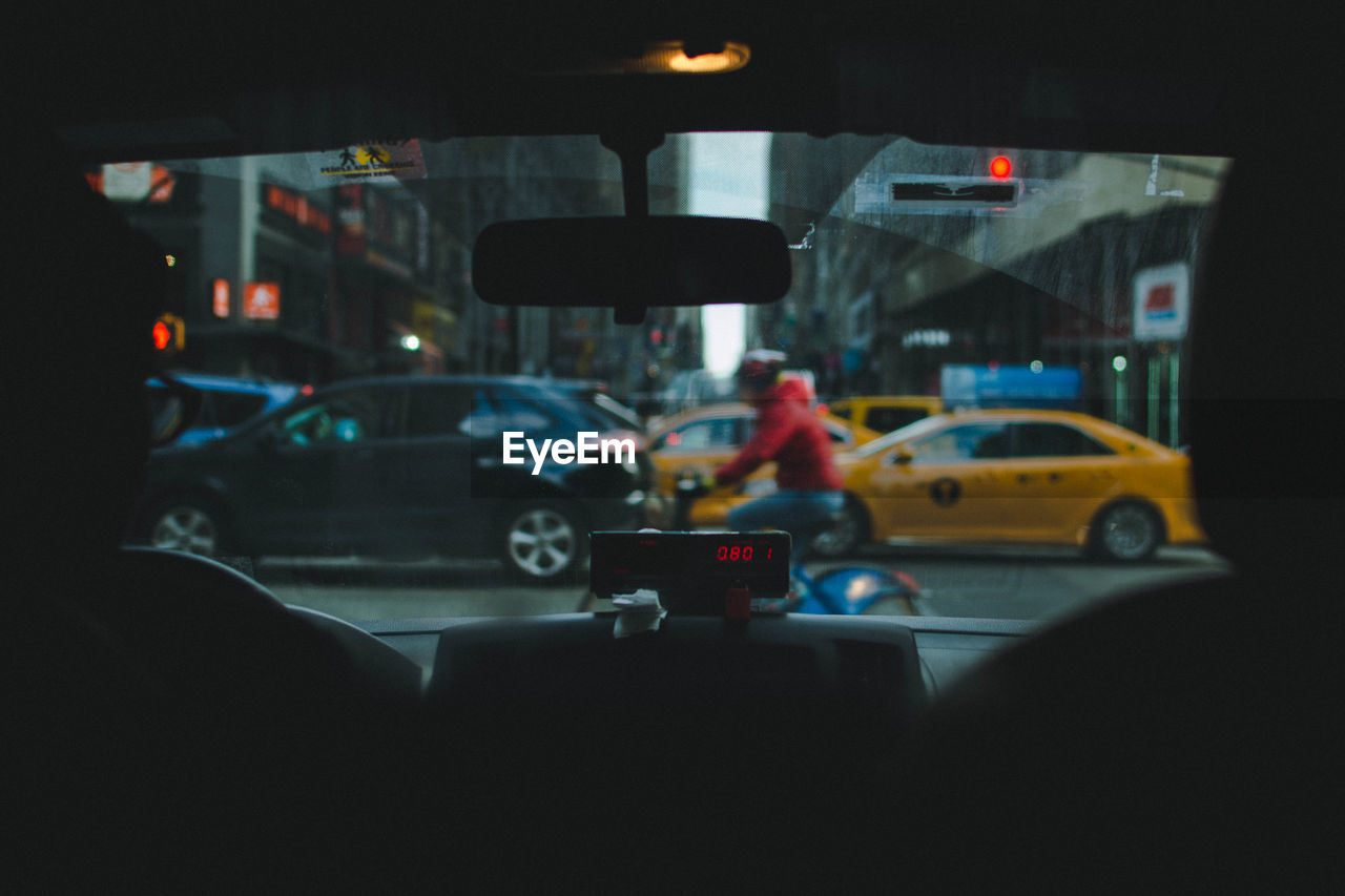 Rear view of man driving car